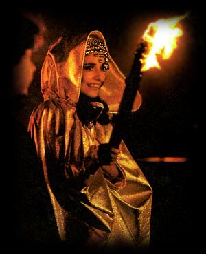 Babetta in Japan performing a ritual with fire